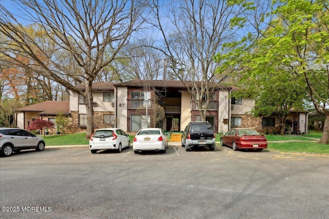 87 Arrowood Rd Unit D, Manalapan, NJ 07726 - view of property with uncovered parking