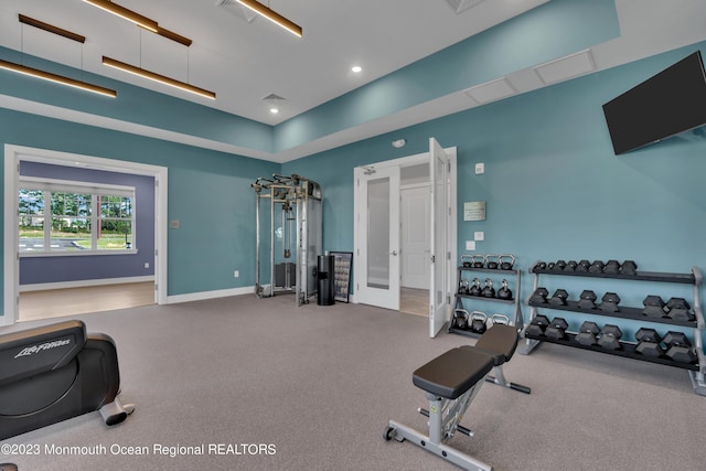 workout room with recessed lighting and baseboards