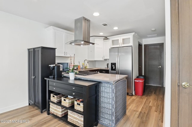 103 Carr Ave, Keansburg, NJ 07734 - kitchen featuring stainless steel fridge with ice dispenser, island exhaust hood, light wood finished floors, white cabinetry, and recessed lighting