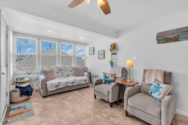 living area with baseboards, ceiling fan, and recessed lighting