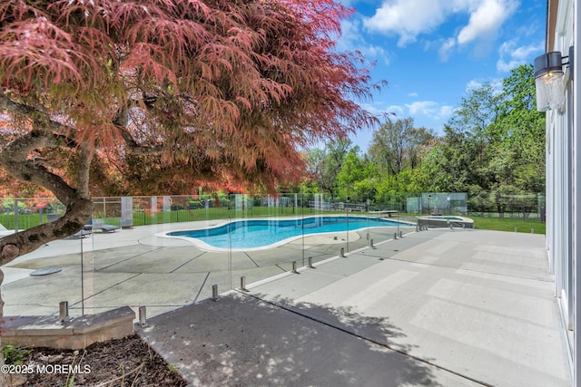 63 Carriage Hill Dr, Colts Neck, NJ 07722 - view of pool with a fenced in pool, a diving board, a patio area, and fence
