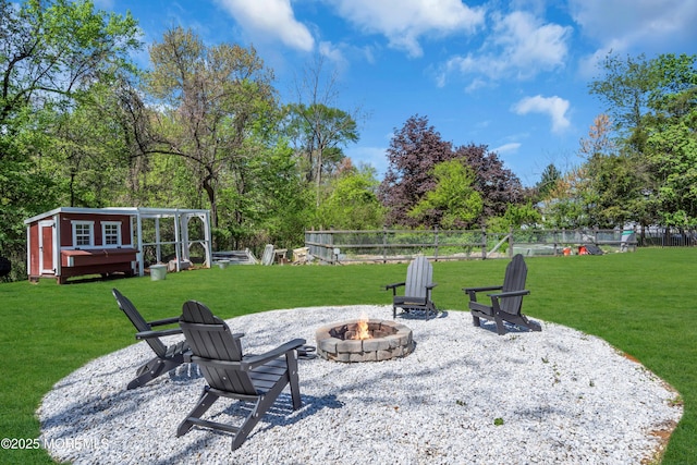 63 Carriage Hill Dr, Colts Neck, NJ 07722 - view of patio / terrace featuring fence, an outdoor structure, and a fire pit