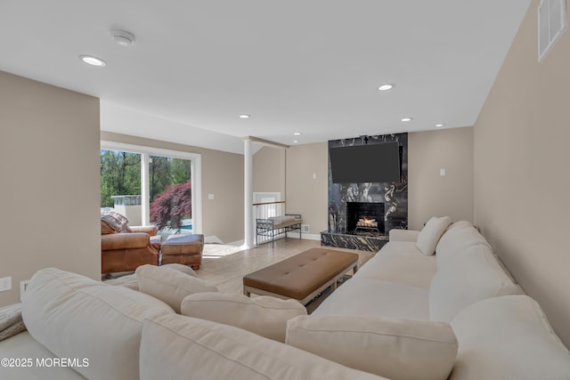 63 Carriage Hill Dr, Colts Neck, NJ 07722 - living room featuring recessed lighting, a premium fireplace, and visible vents