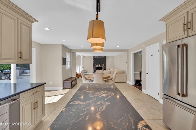 63 Carriage Hill Dr, Colts Neck, NJ 07722 - kitchen with stainless steel appliances, dark countertops, open floor plan, and cream cabinetry
