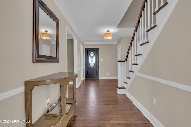 63 Carriage Hill Dr, Colts Neck, NJ 07722 - entryway with visible vents, ornamental molding, dark wood-style flooring, stairs, and baseboards
