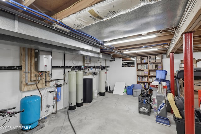 unfinished basement featuring tankless water heater