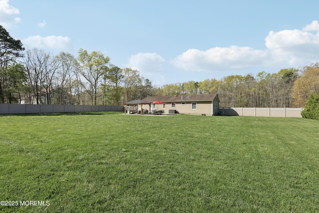 view of yard with a gazebo and a fenced backyard