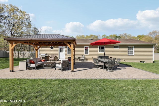 view of patio / terrace with fence, a gazebo, and outdoor lounge area