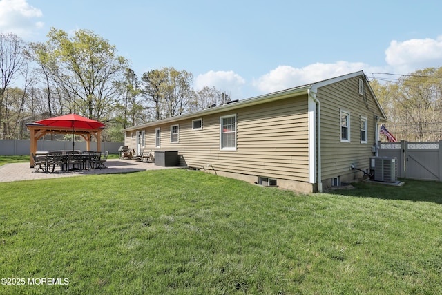rear view of property with a patio, fence, a yard, and cooling unit