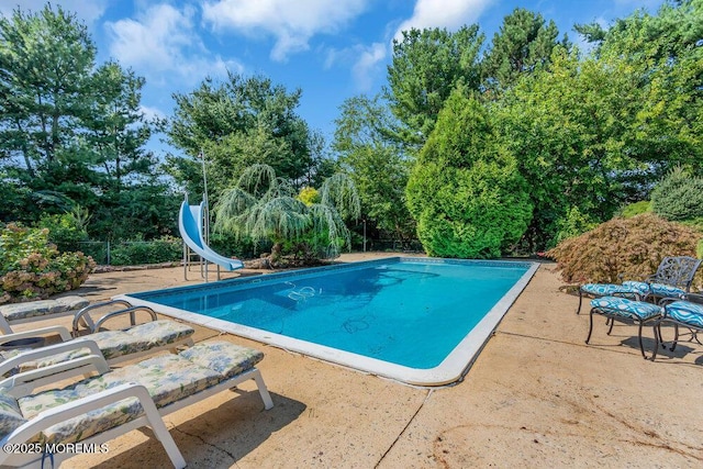 1 Flintlock Rd, Freehold, NJ 07728 - outdoor pool featuring a patio area, a water slide, and fence