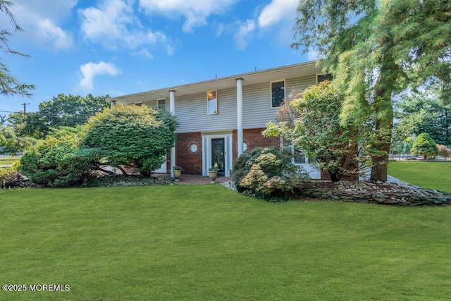 1 Flintlock Rd, Freehold, NJ 07728 - view of front of property featuring brick siding and a front lawn