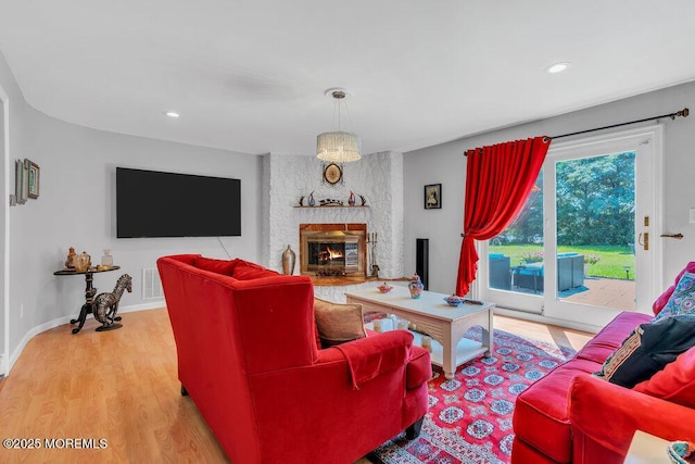 1 Flintlock Rd, Freehold, NJ 07728 - living room featuring recessed lighting, a brick fireplace, light wood-type flooring, and visible vents