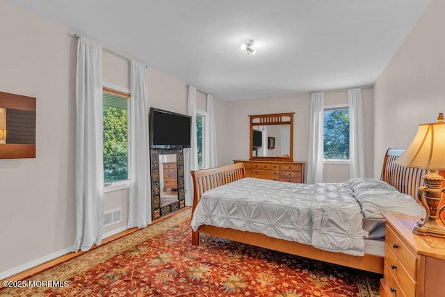 1 Flintlock Rd, Freehold, NJ 07728 - bedroom with baseboards, visible vents, and wood finished floors