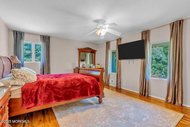 1 Flintlock Rd, Freehold, NJ 07728 - bedroom featuring ceiling fan, baseboards, multiple windows, and wood finished floors