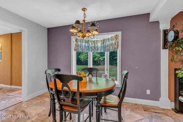 1 Flintlock Rd, Freehold, NJ 07728 - dining room with baseboards, a notable chandelier, and stone finish floor