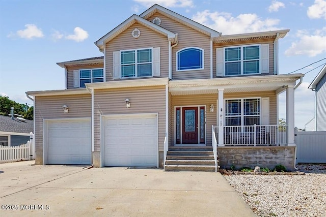 traditional-style house featuring fence, an attached garage, concrete driveway, and a porch