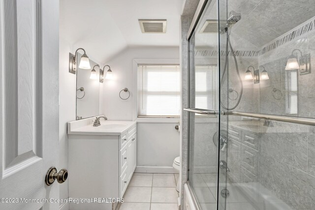 full bathroom featuring visible vents, vanity, tile patterned floors, lofted ceiling, and enclosed tub / shower combo