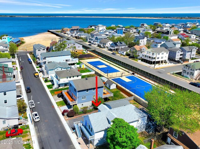 aerial view with a water view and a residential view