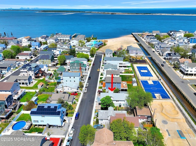 bird's eye view featuring a residential view and a water view