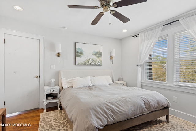 bedroom featuring recessed lighting, baseboards, and wood finished floors