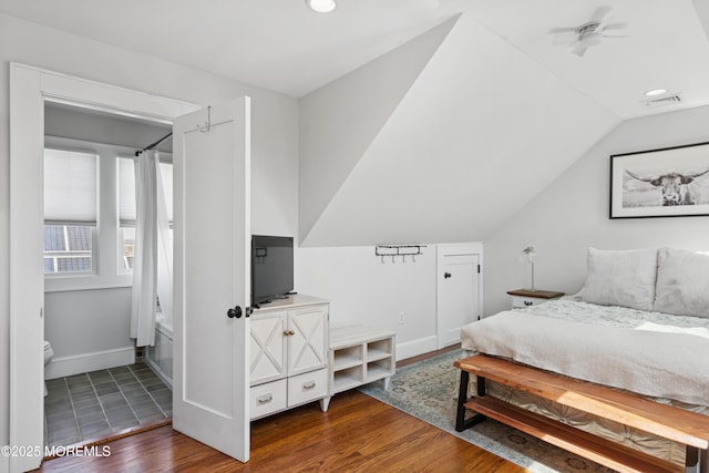 bedroom with lofted ceiling, recessed lighting, baseboards, visible vents, and wood finished floors