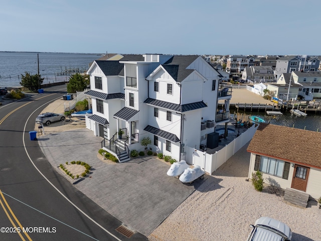 aerial view with a water view and a residential view