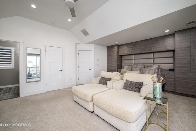 bedroom featuring visible vents, carpet flooring, and lofted ceiling