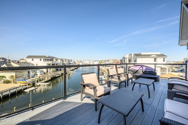 wooden terrace with a water view