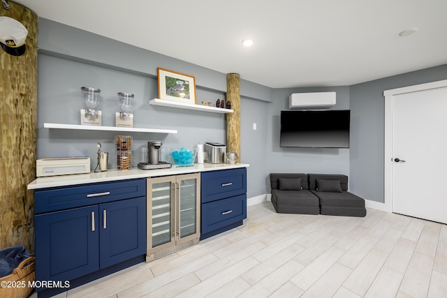 bar with an AC wall unit, beverage cooler, light wood-style flooring, wet bar, and baseboards
