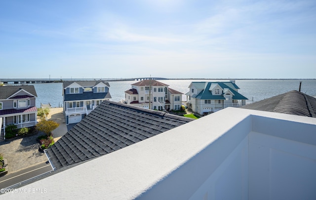 exterior details featuring a residential view and a shingled roof