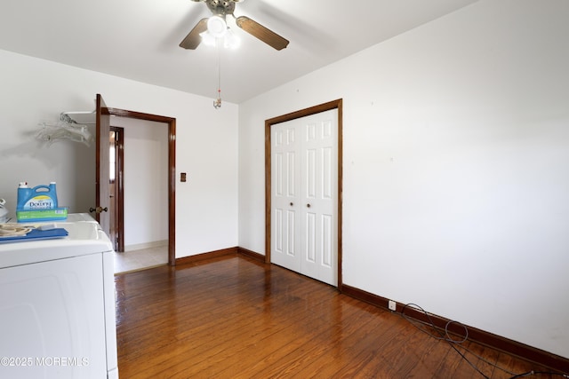 spare room featuring washer / dryer, baseboards, ceiling fan, and light wood-style floors