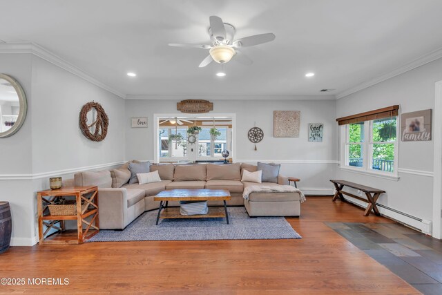 living room with ceiling fan, crown molding, wood finished floors, a baseboard heating unit, and recessed lighting