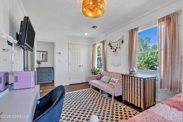 interior space with crown molding, recessed lighting, wood finished floors, visible vents, and a closet