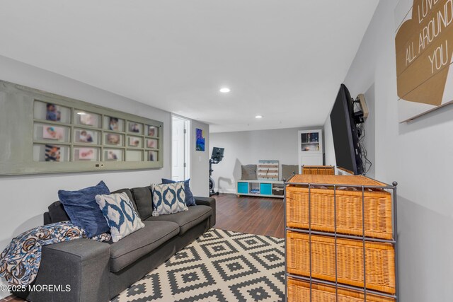 living room with recessed lighting and wood finished floors