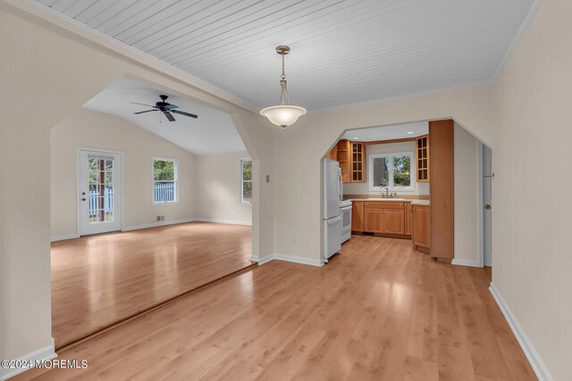 188 Five Points Rd, Colts Neck, NJ 07722 - unfurnished dining area with light wood-style floors, arched walkways, a sink, and a wealth of natural light