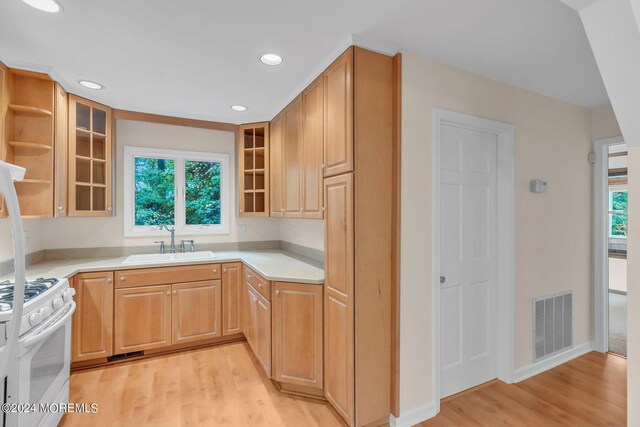 188 Five Points Rd, Colts Neck, NJ 07722 - kitchen with visible vents, glass insert cabinets, white gas stove, a sink, and light wood finished floors