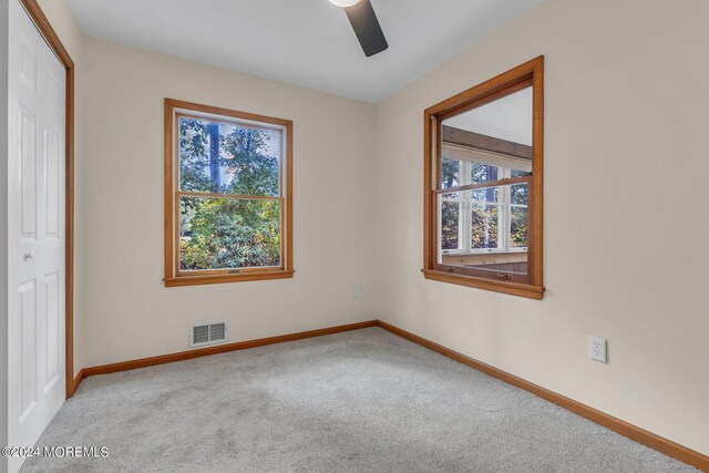 188 Five Points Rd, Colts Neck, NJ 07722 - carpeted spare room featuring baseboards, a ceiling fan, and visible vents