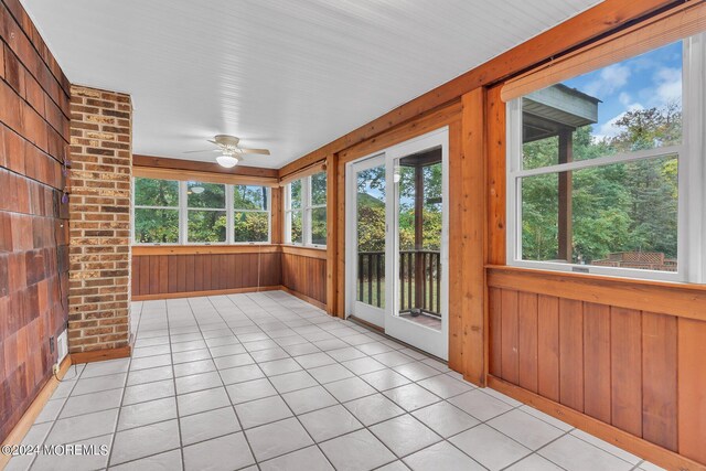 188 Five Points Rd, Colts Neck, NJ 07722 - unfurnished sunroom with wooden walls and tile patterned flooring