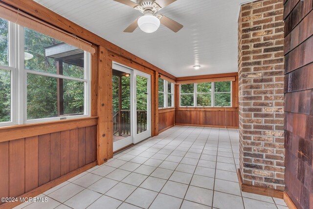188 Five Points Rd, Colts Neck, NJ 07722 - unfurnished sunroom featuring tile patterned flooring and wood walls