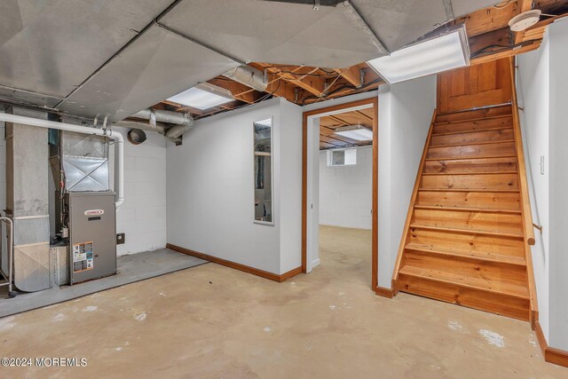 188 Five Points Rd, Colts Neck, NJ 07722 - basement with stairs, baseboards, and heating unit