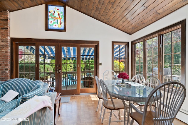 sunroom featuring vaulted ceiling, wooden ceiling, plenty of natural light, and french doors