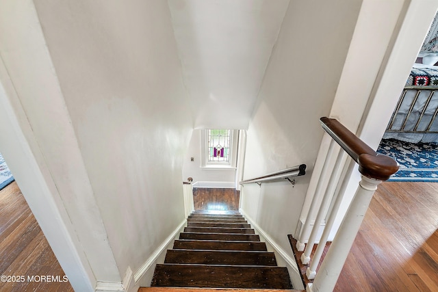 staircase featuring hardwood / wood-style floors