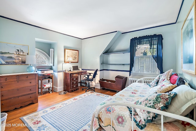 bedroom with wood finished floors