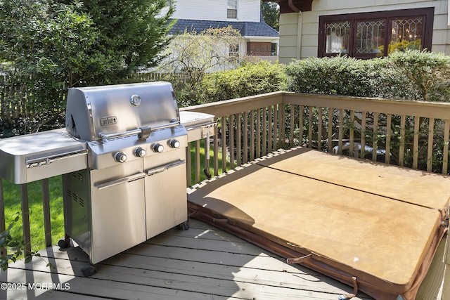 wooden terrace with a grill
