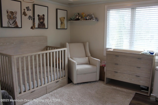23 Layton Ave, Pine Beach, NJ 08741 - bedroom with multiple windows, a nursery area, and ornamental molding