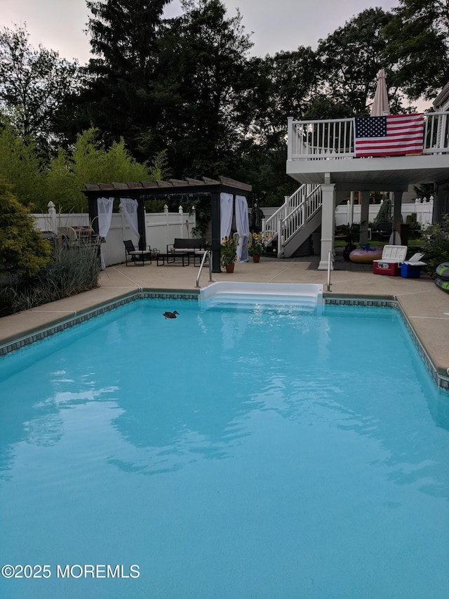 23 Layton Ave, Pine Beach, NJ 08741 - swimming pool with a patio, fence, stairs, and view of wooded area
