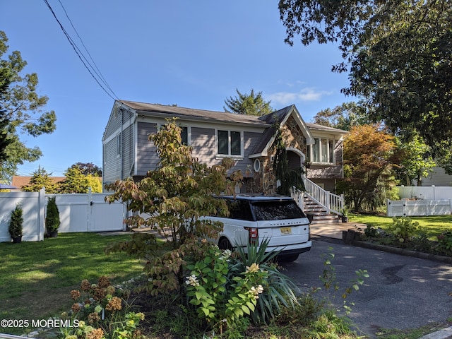 23 Layton Ave, Pine Beach, NJ 08741 - view of front of house with stone siding and a gate