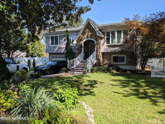 23 Layton Ave, Pine Beach, NJ 08741 - split foyer home featuring a garage and stone siding