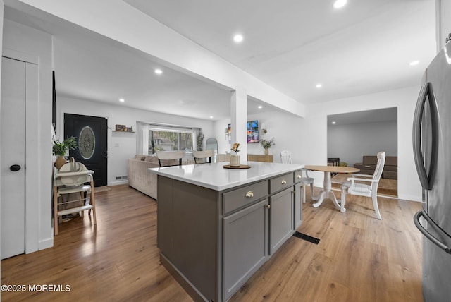 113 Darien Rd, Howell, NJ 07731 - kitchen with gray cabinetry, freestanding refrigerator, light countertops, light wood-style floors, and open floor plan