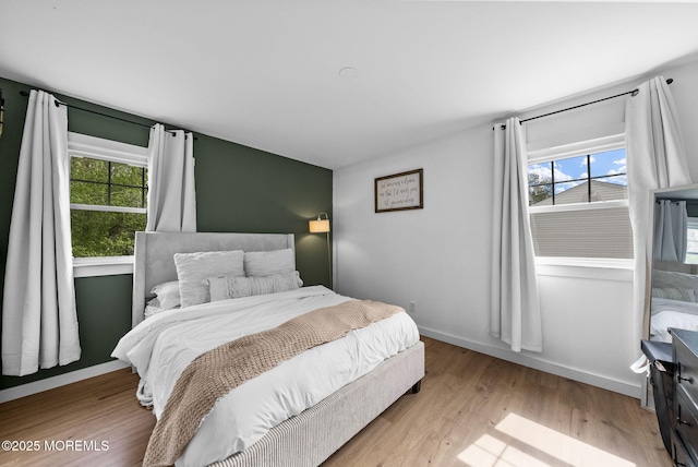 113 Darien Rd, Howell, NJ 07731 - bedroom featuring multiple windows, wood finished floors, and baseboards